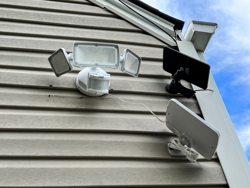 Outdoor security light illuminating a London driveway at night